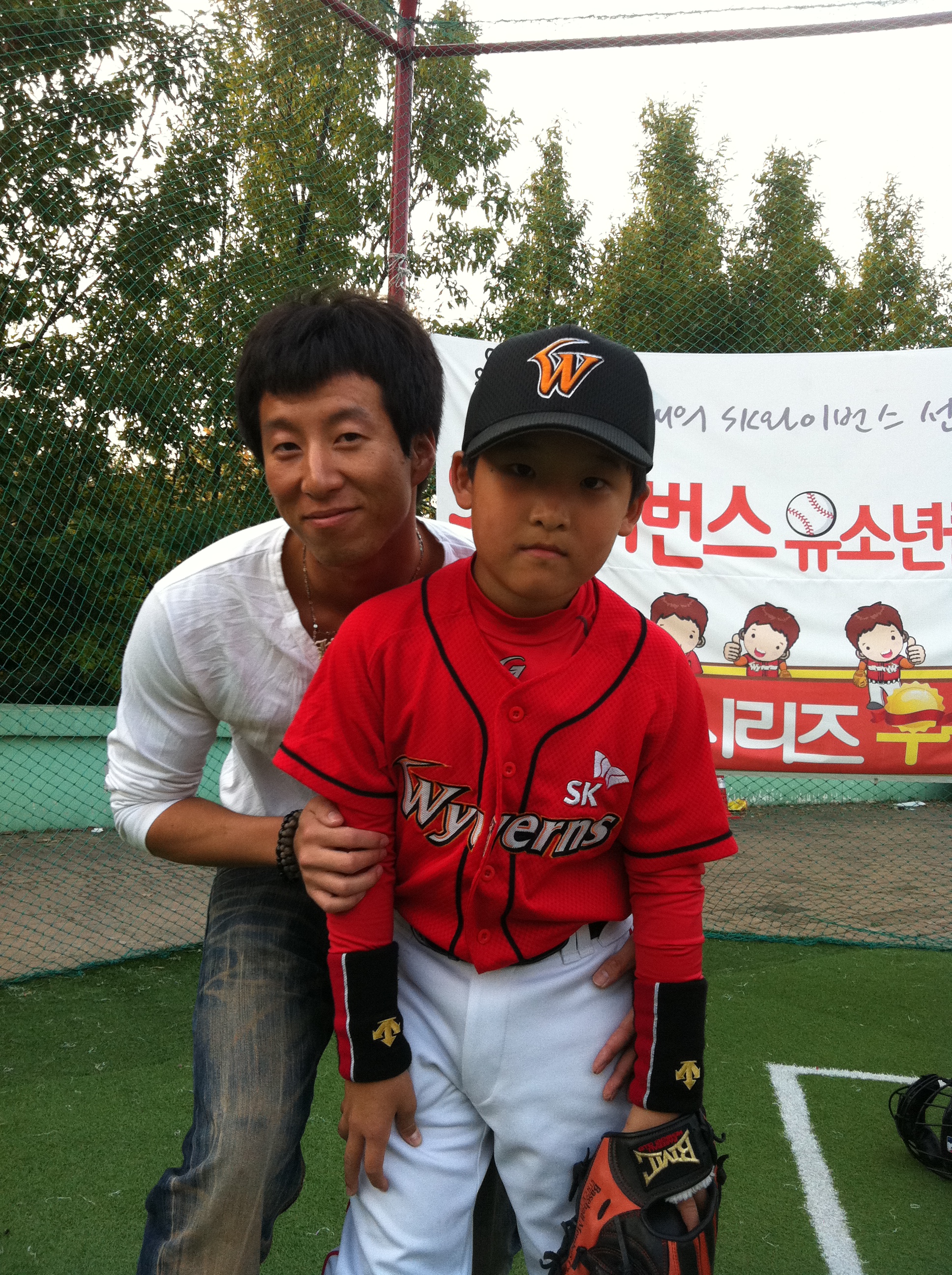 Wearing an SK Wyverns uniform as a child